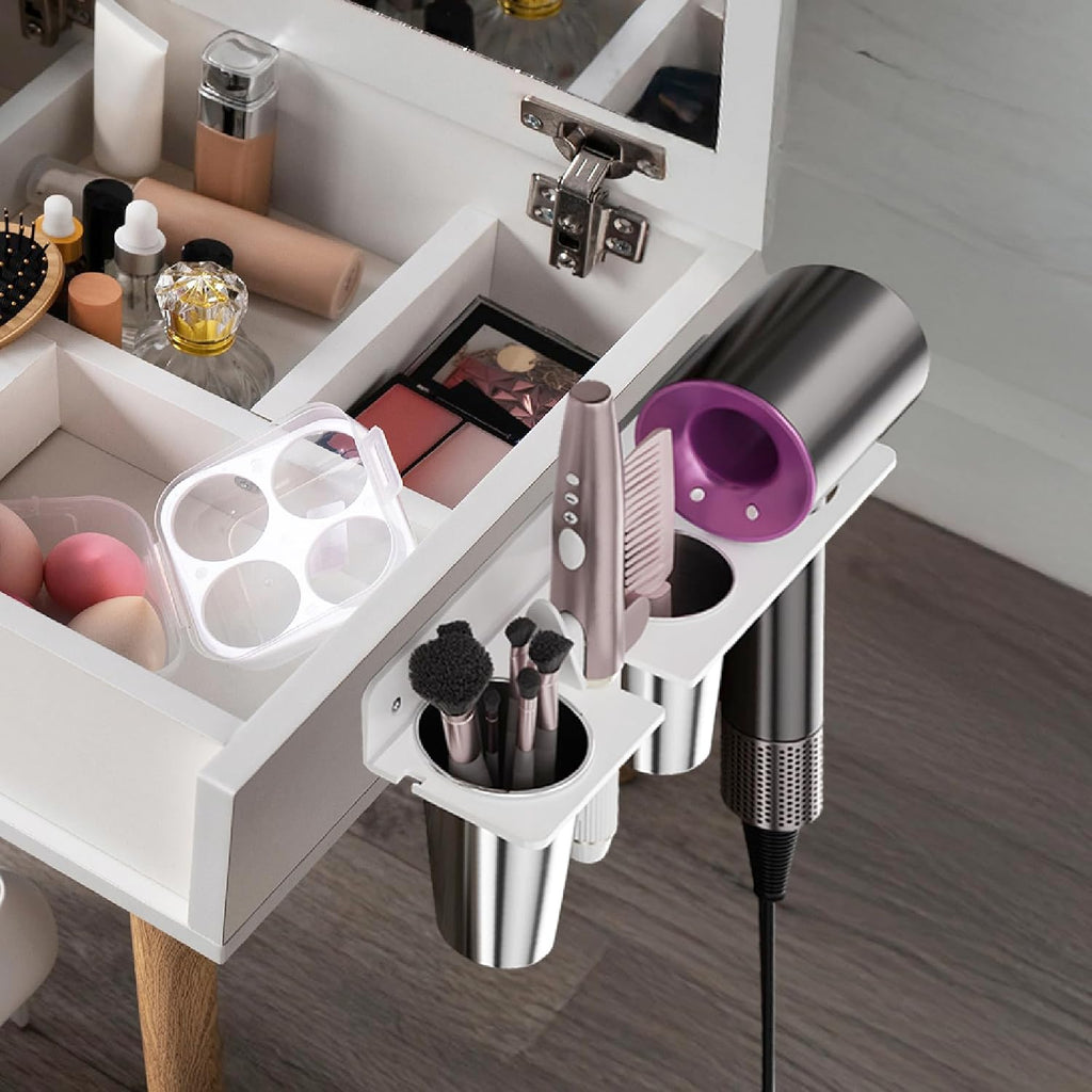 White wall-mount hair-tool organizer with two cups, front view — installed beside a vanity
